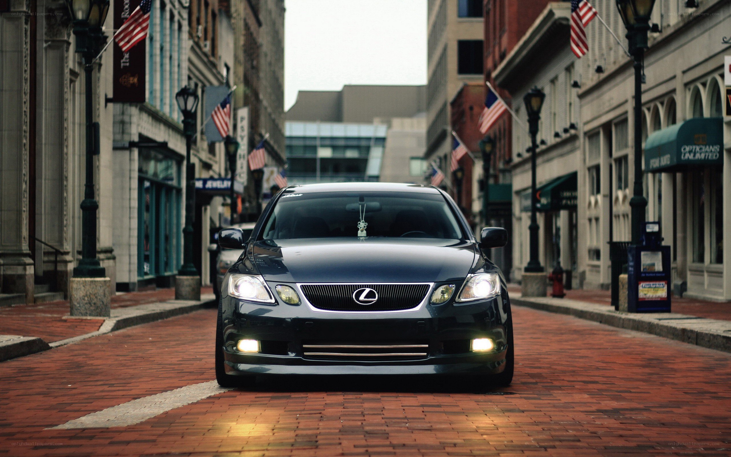 Lexus on a brick street