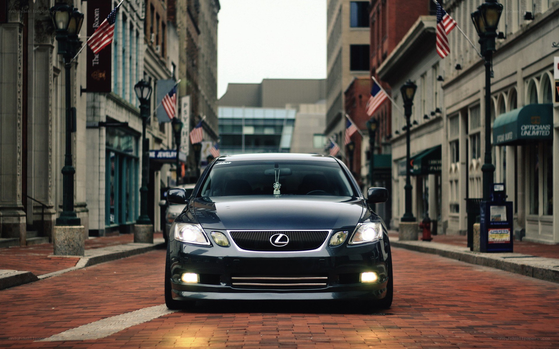 Lexus on a brick street