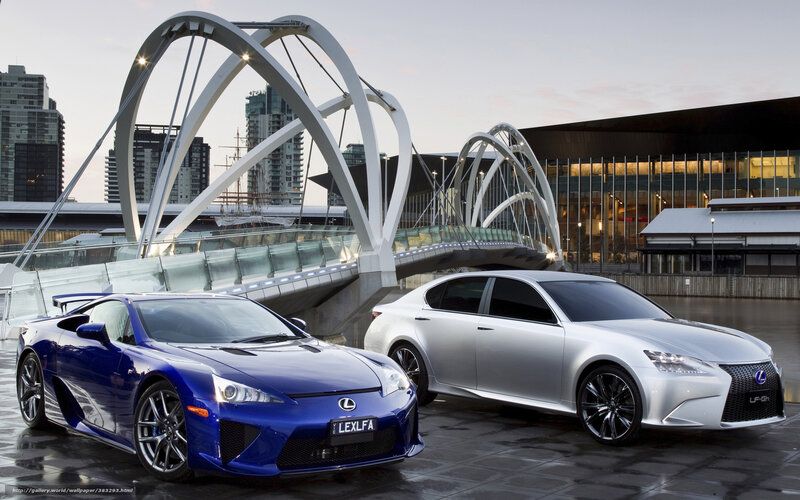 Lexus sports cars on city bridge