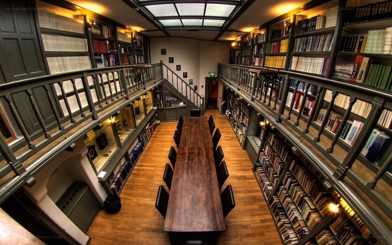library with long table and bookshelves