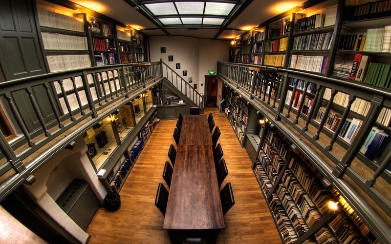library with long table and bookshelves