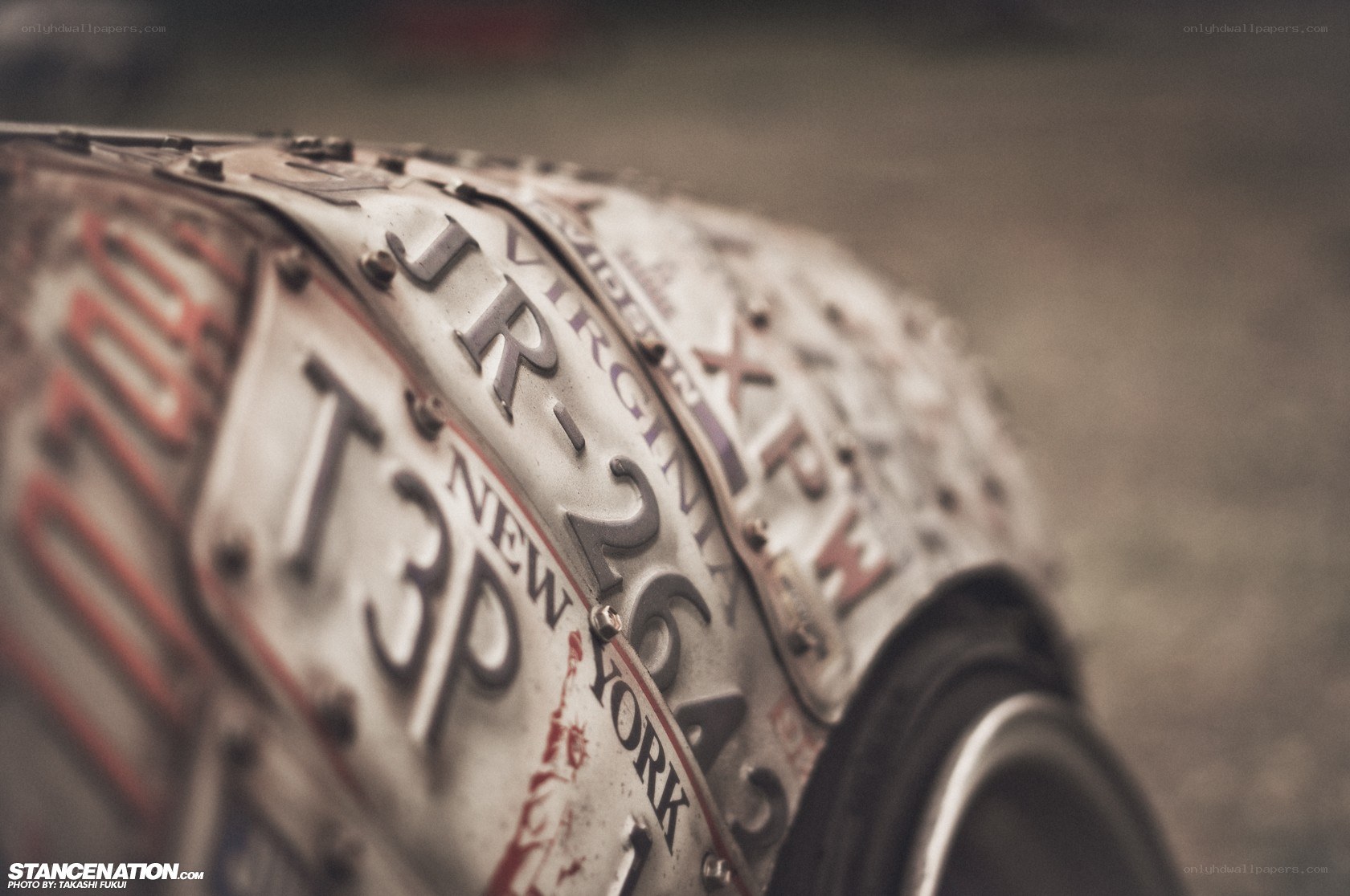 license plates on a car wheel