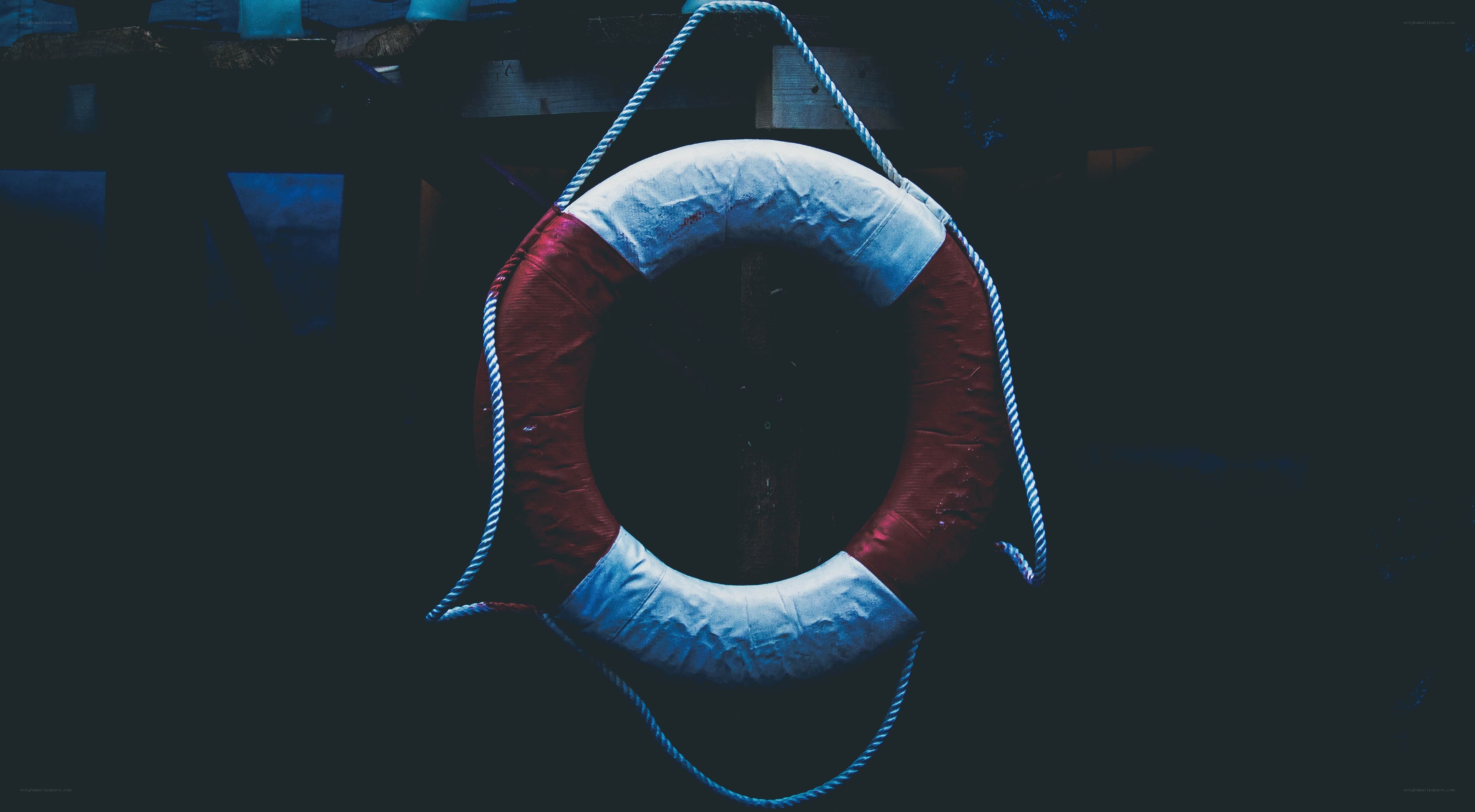 Life preserver hanging in dim light