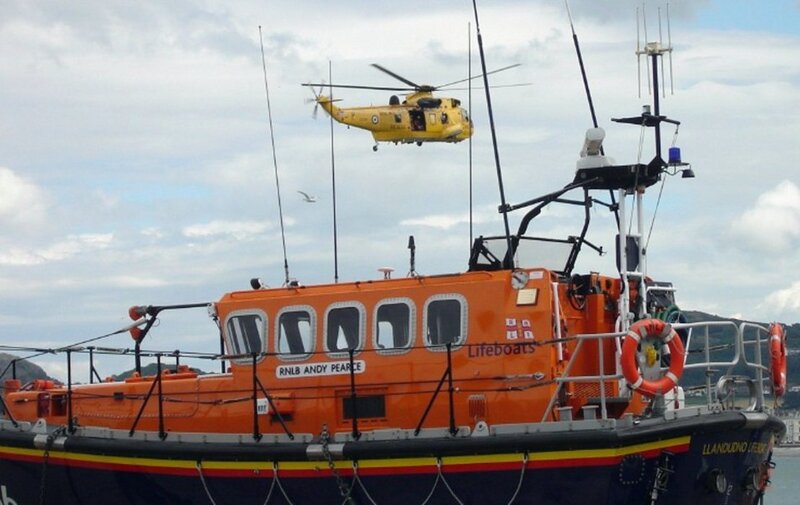 Lifeboat and helicopter at sea