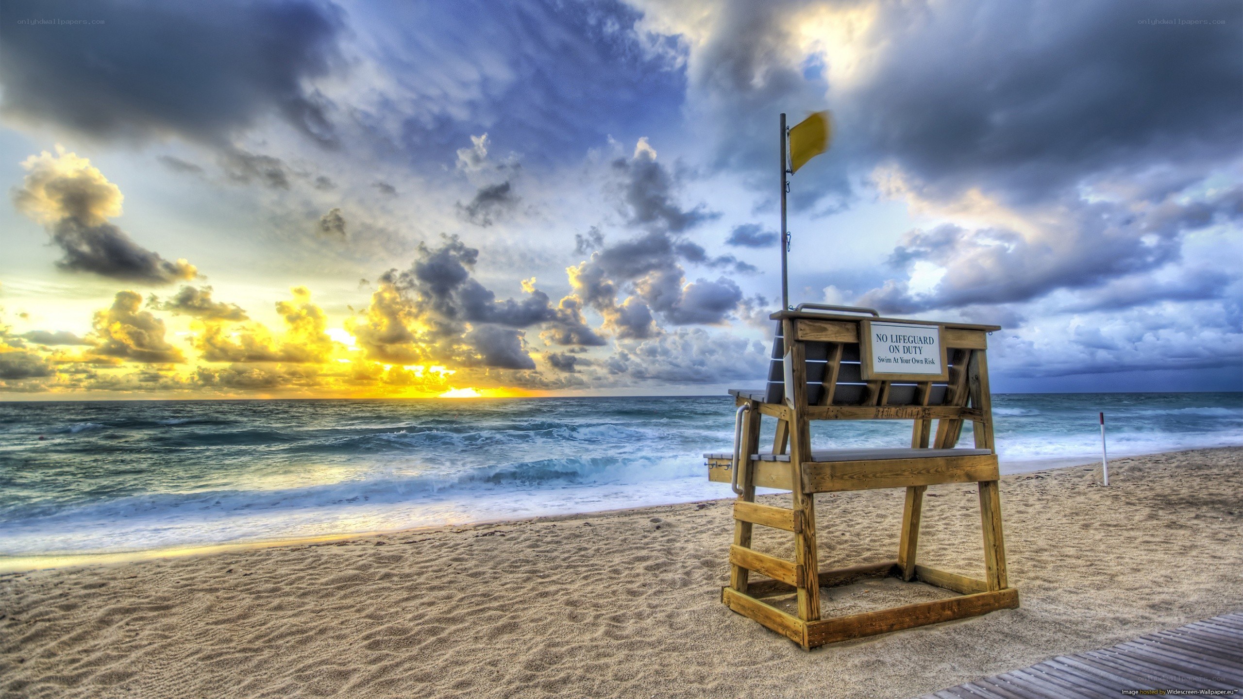 Lifeguard chair at sunset
