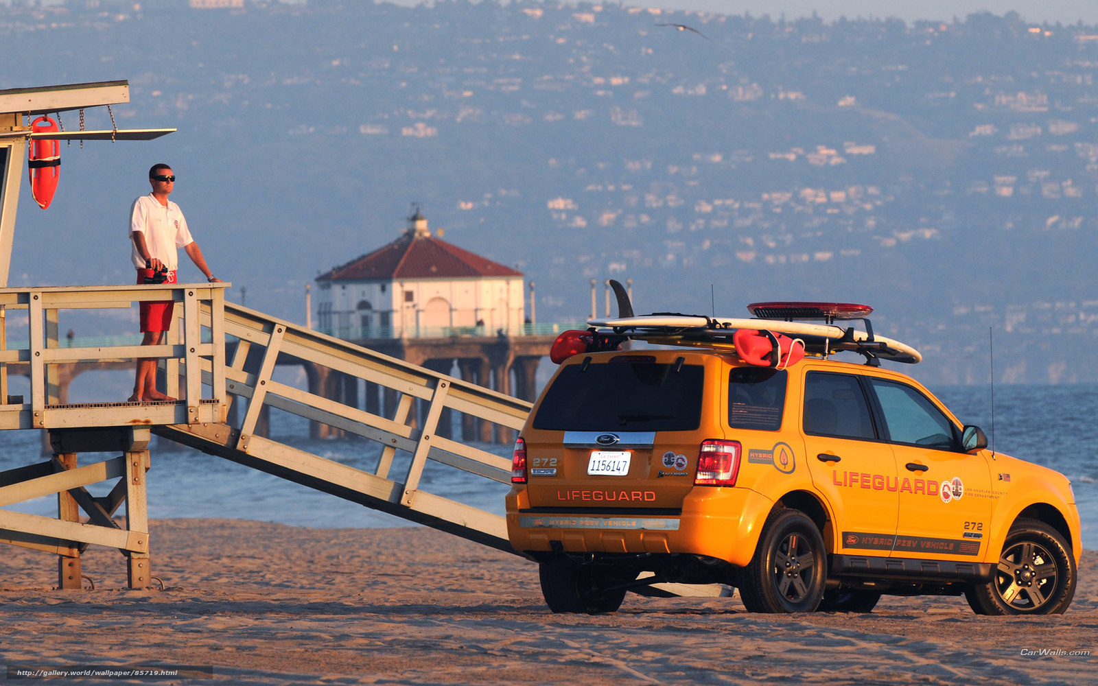 Lifeguard on beach at sunset
