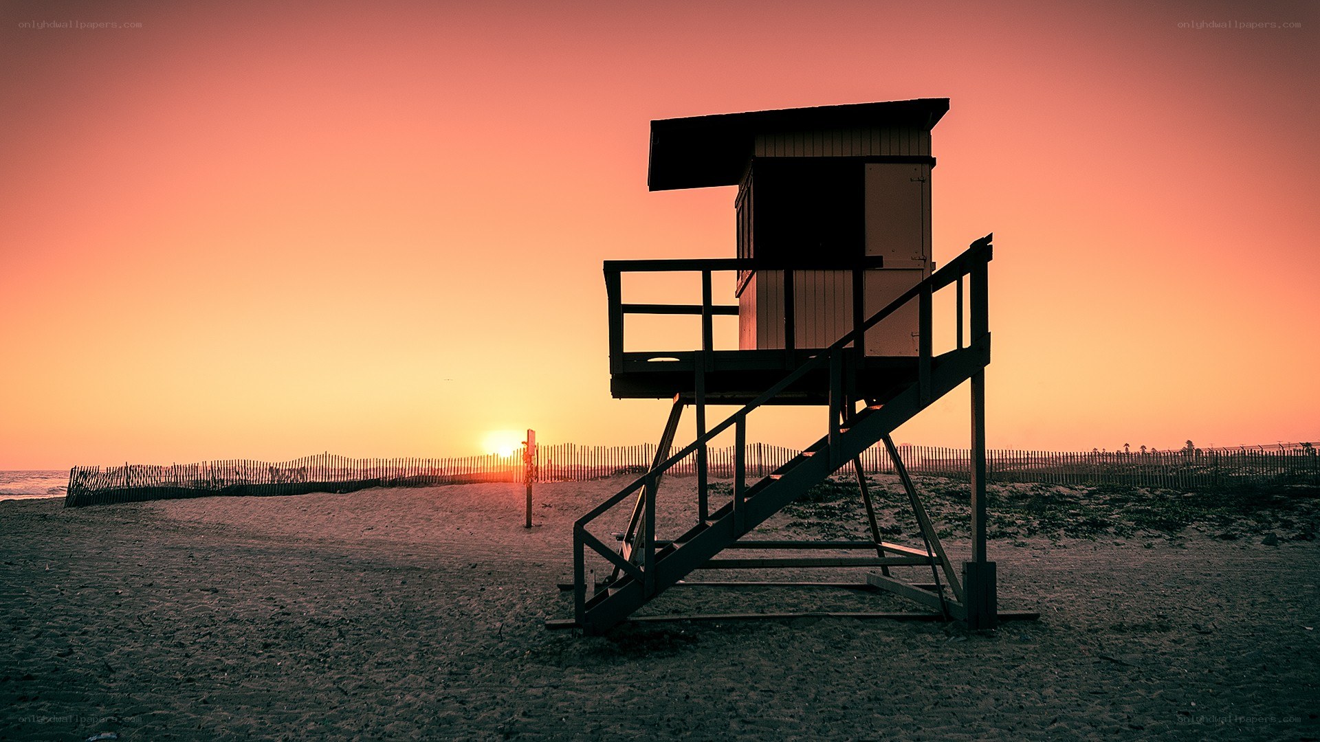 Lifeguard tower at sunset
