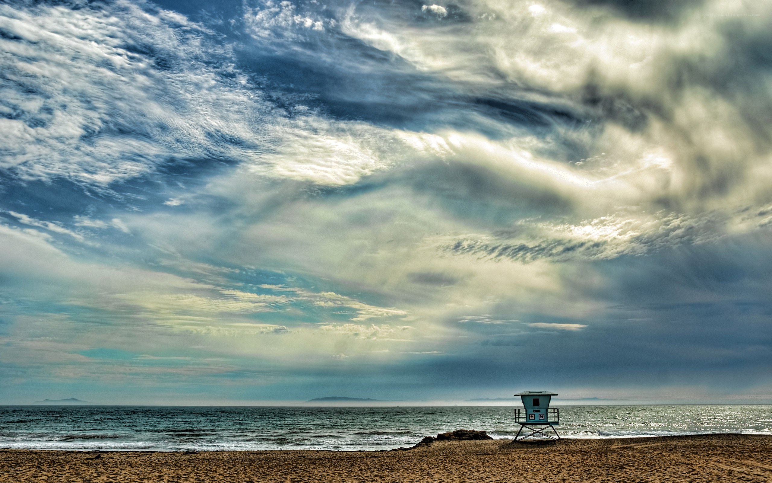 Lifeguard tower on a cloudy beach