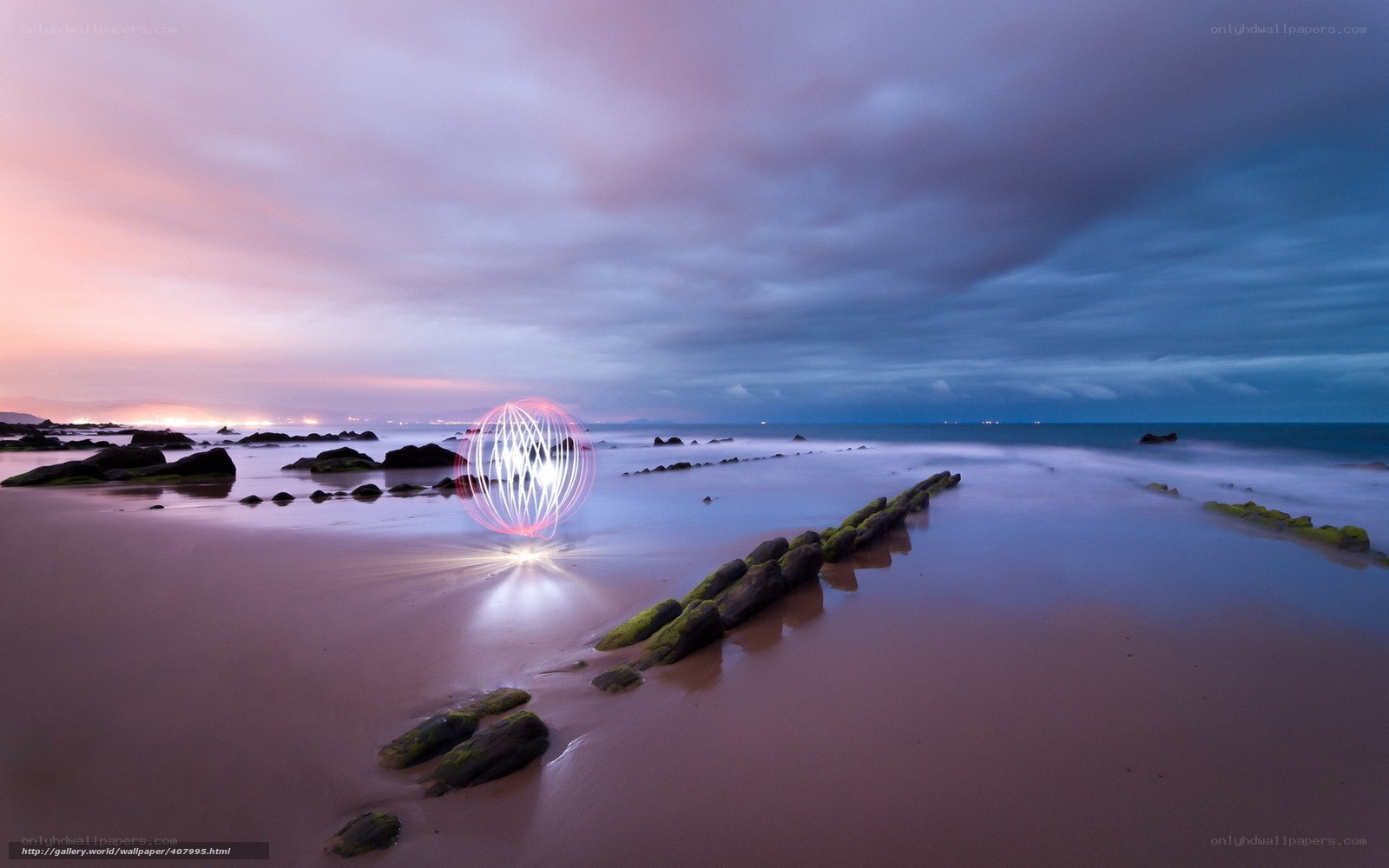 Light art on a beach at dusk