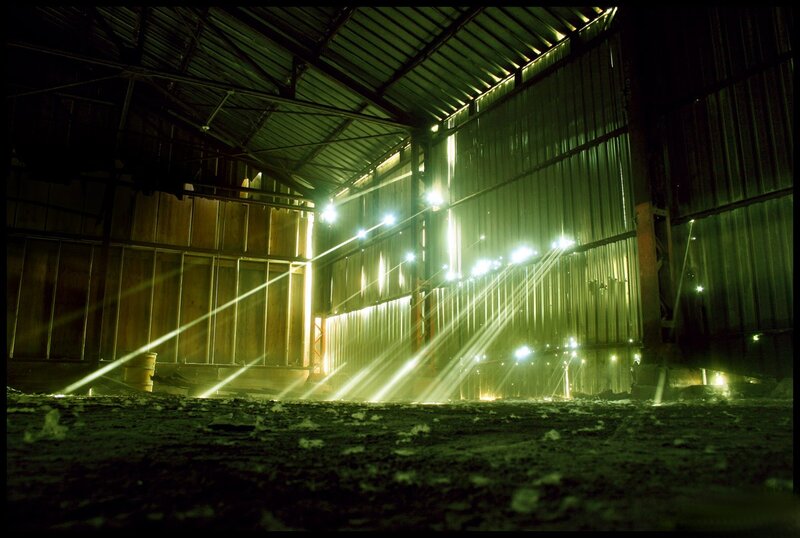 Light beams in an industrial warehouse