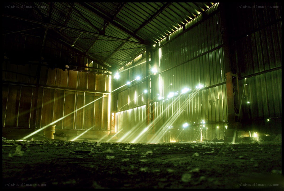 Light beams in an industrial warehouse