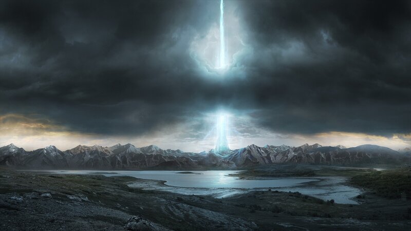 Light beams over mountain lake