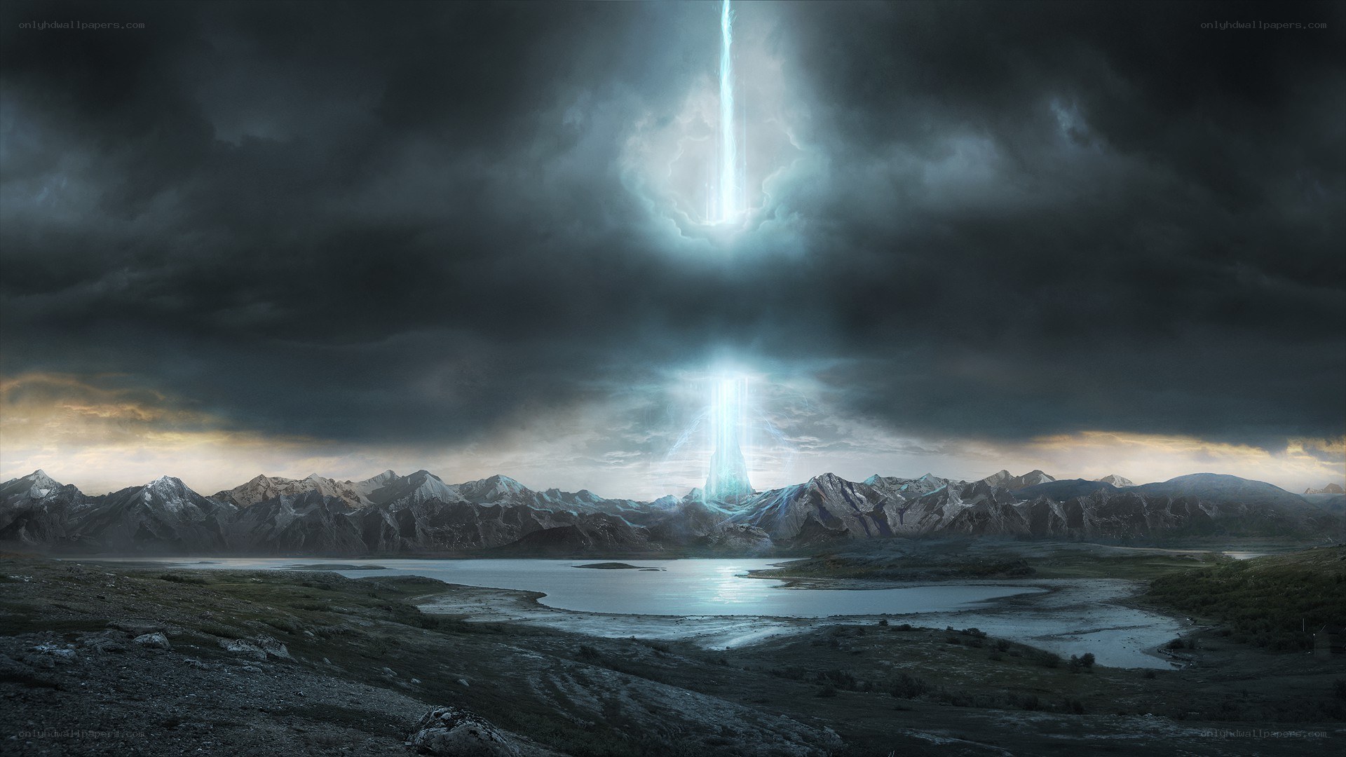 Light beams over mountain lake