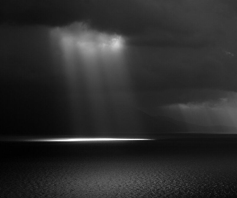 Light Beams over Water — Black, Dramatic