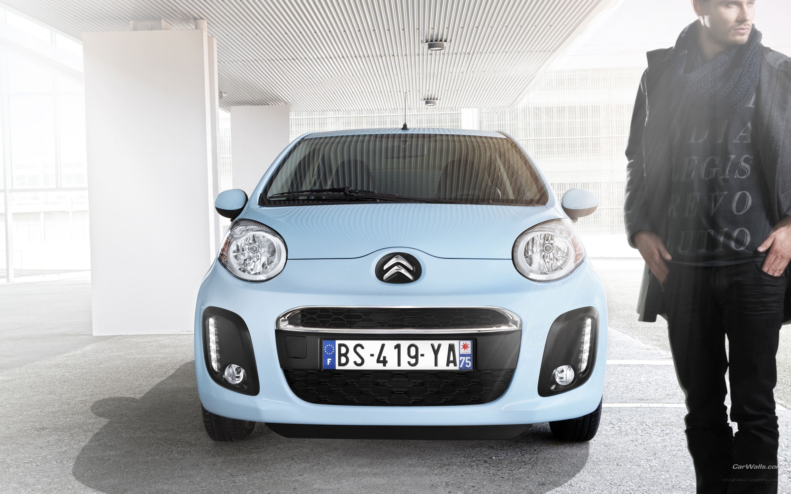 Light blue Citroën car with man