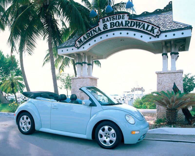Light blue convertible at marina entrance