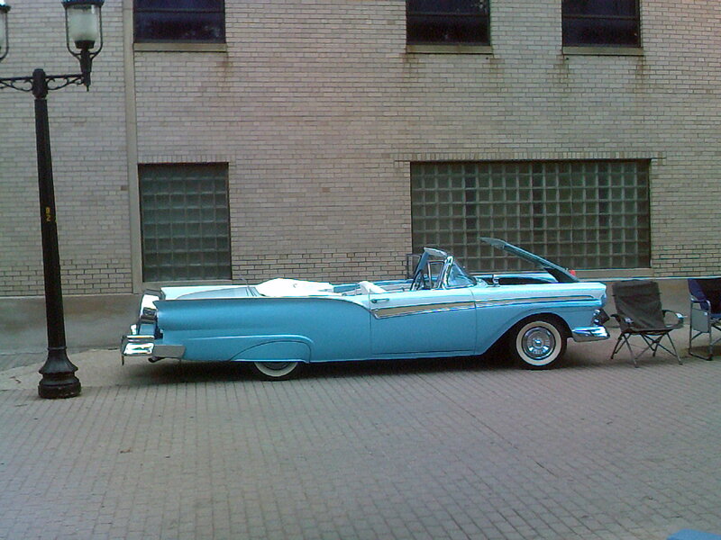 Light-blue Convertible Car — Blue, Calm, Afternoon, Photograph, Brick Building