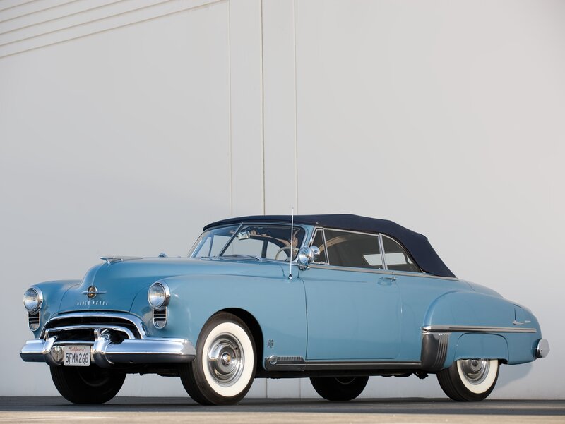 Light Blue Convertible Car — Calm, Afternoon, Photograph, Black Soft Top