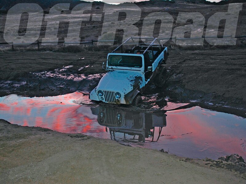 Light Blue Jeep in Mud
