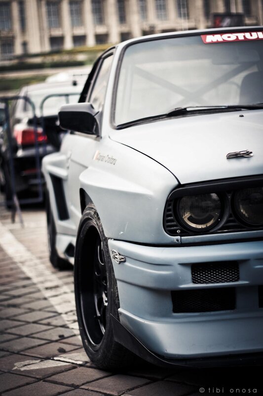light blue race car on street