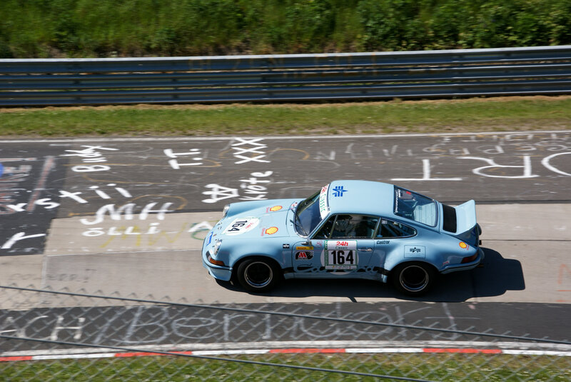 Light blue race car on track
