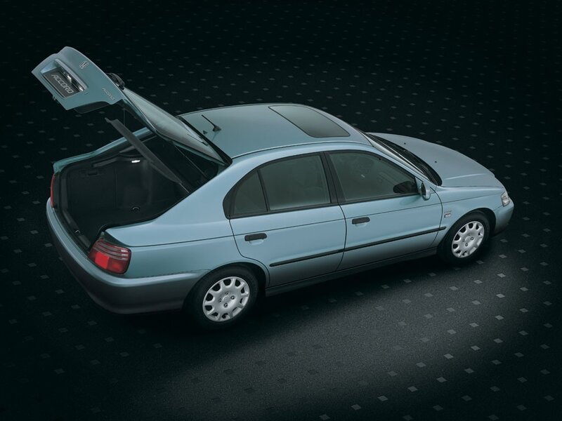 Light blue sedan with open trunk