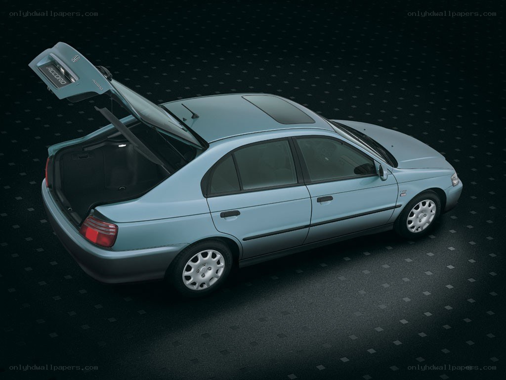 Light blue sedan with open trunk