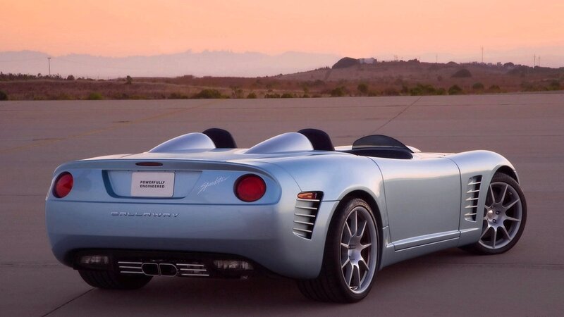 Light blue sports car at sunset