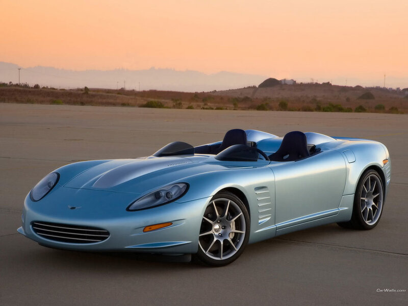 light blue sports car at sunset