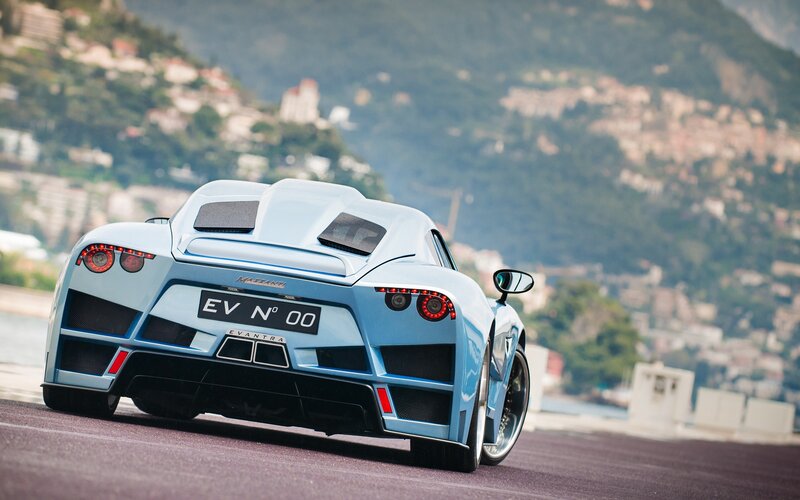 Light Blue Sports Car — Dynamic, Afternoon, Photograph, Mountain