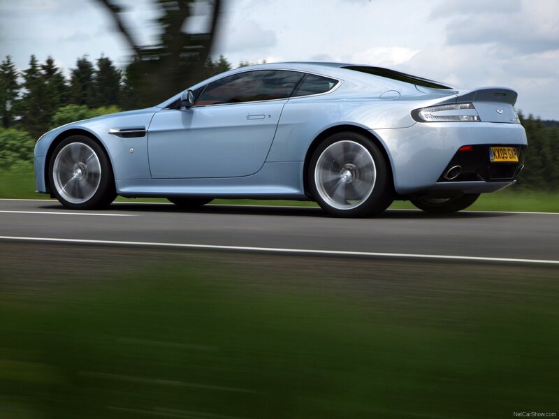 light blue sports car in motion