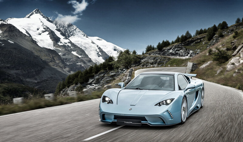 Light blue sports car on mountain road