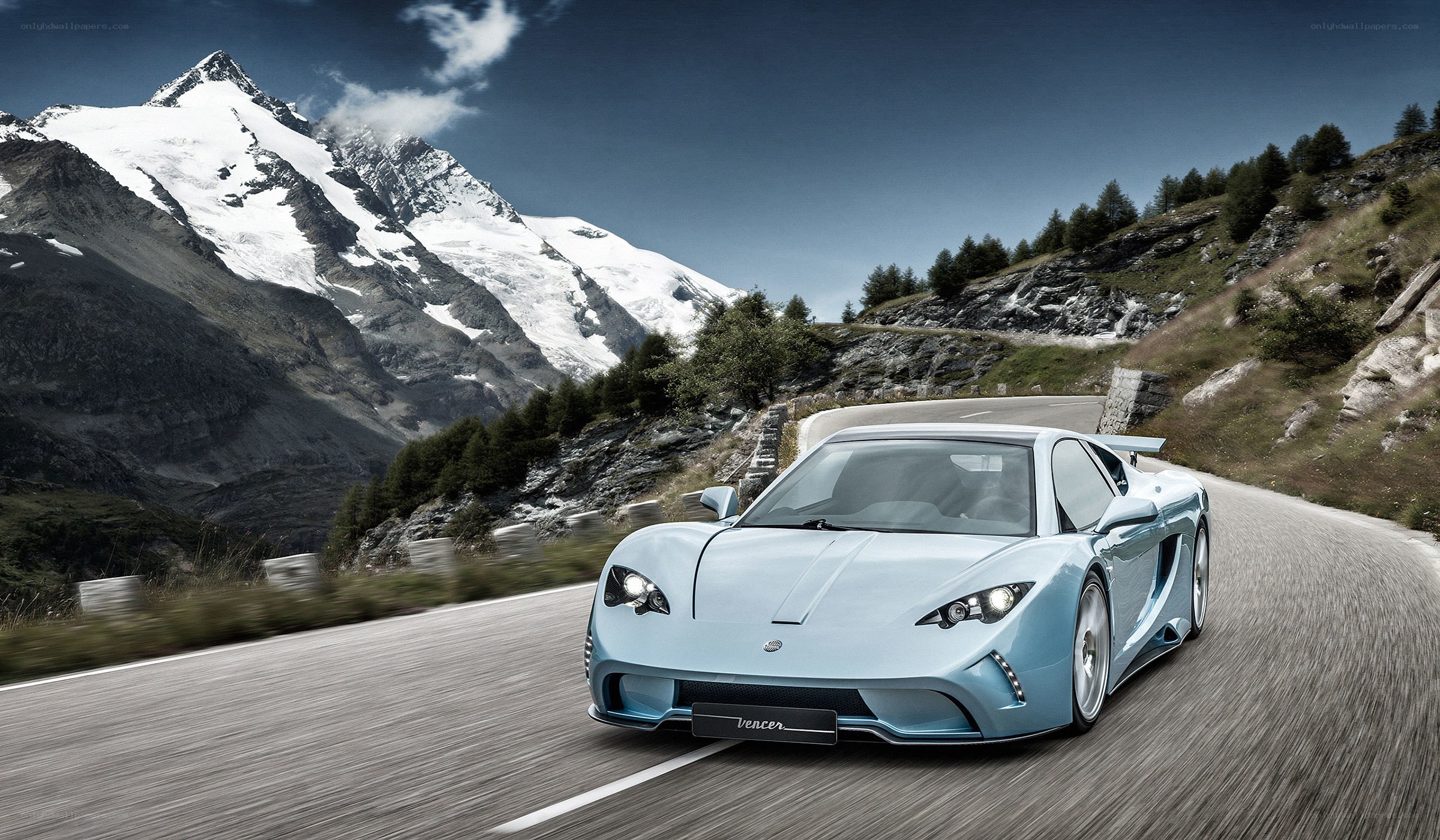 Light blue sports car on mountain road