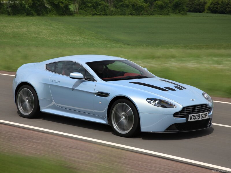 light blue sports car on road