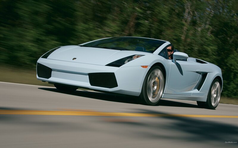 light blue sports car on road