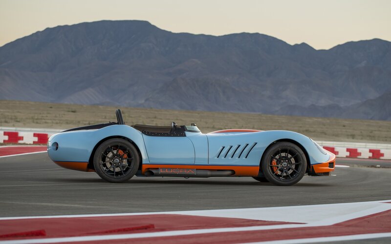 Light blue sports car on track