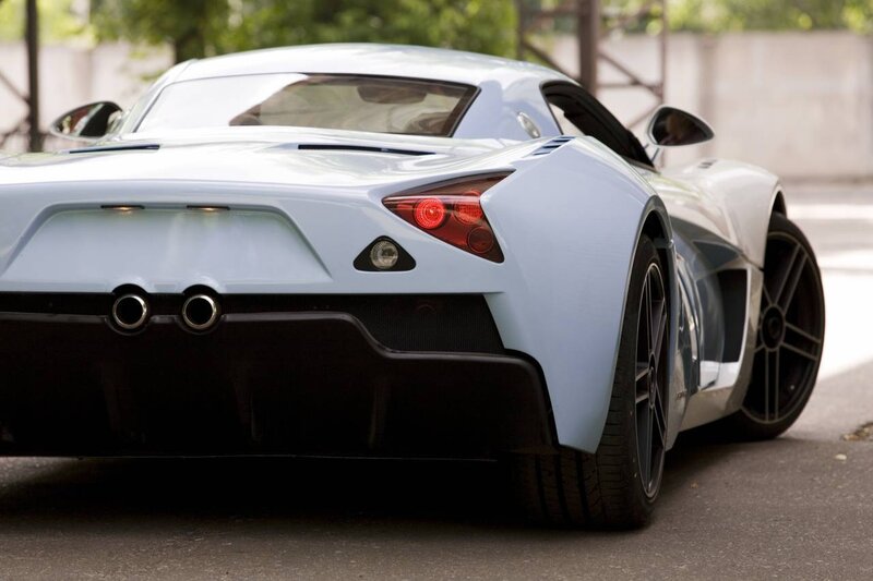 light blue sports car rear view