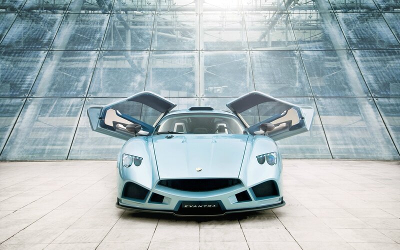 Light blue sports car with open doors