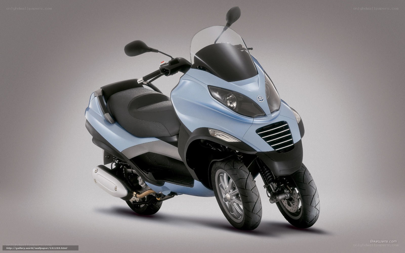 light blue three-wheeled scooter