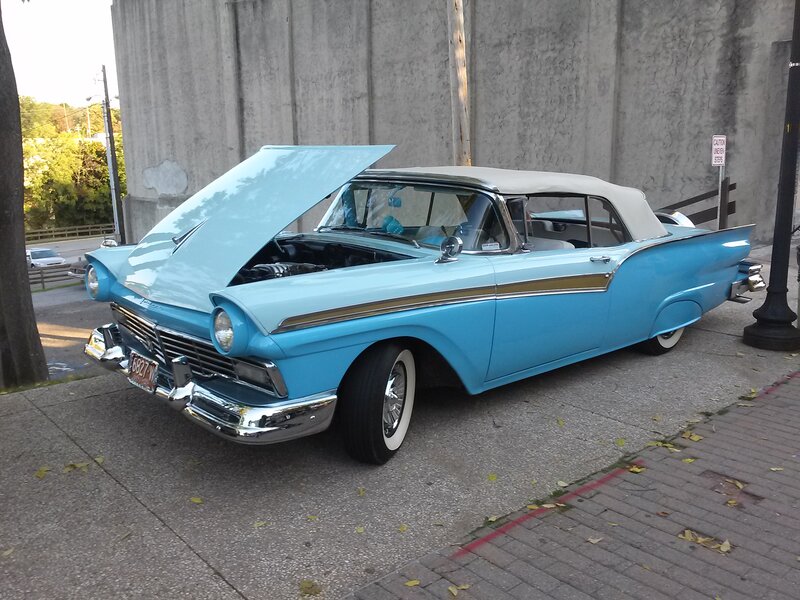 Light Blue Vintage Car — Calm, Afternoon, Photograph, Concrete Wall