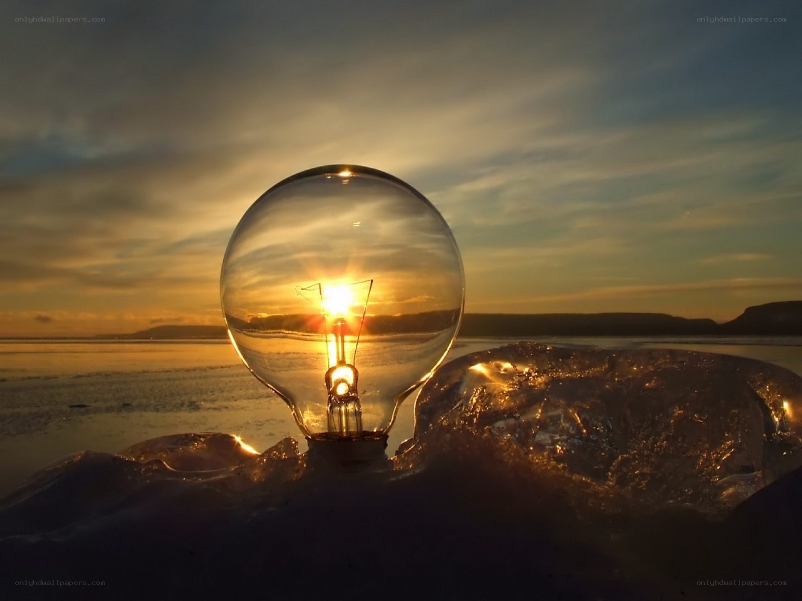 Light bulb at sunset on ice
