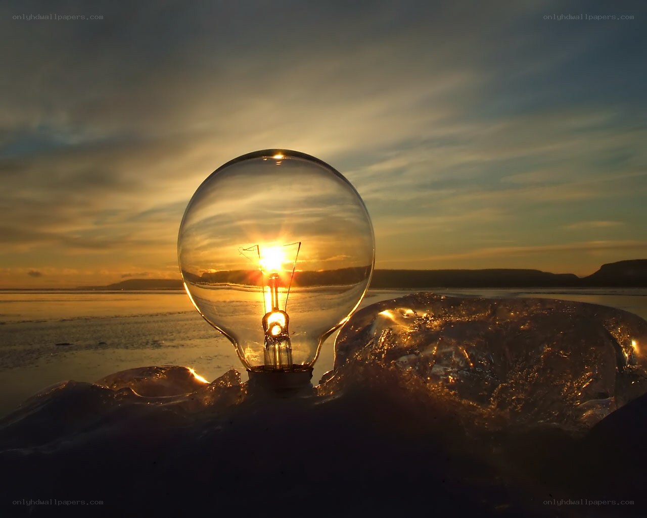 Light bulb at sunset on ice