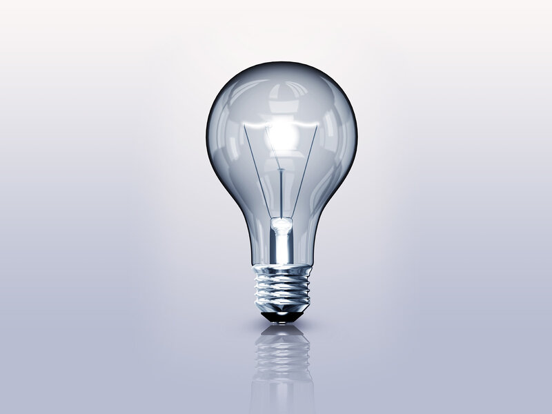 Light bulb on reflective surface