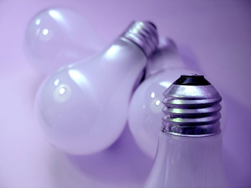Light bulbs on purple background