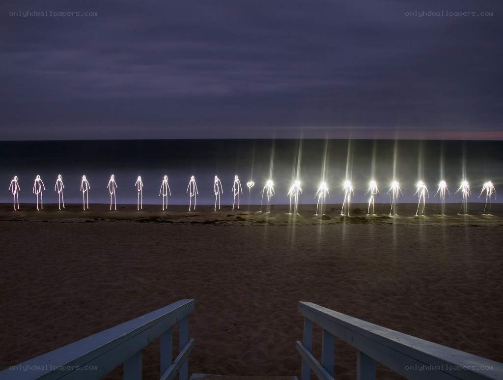 Light figures on a beach