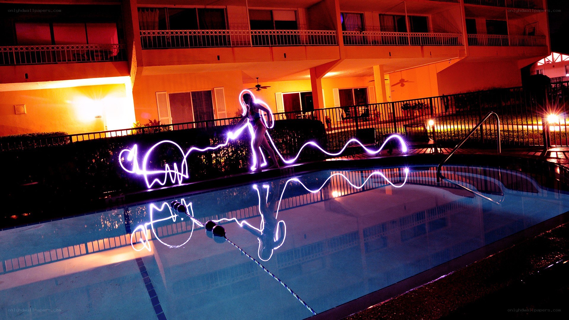 light painting by pool at night