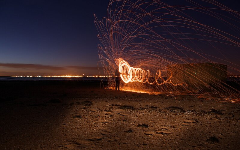 Light painting on a beach at night
