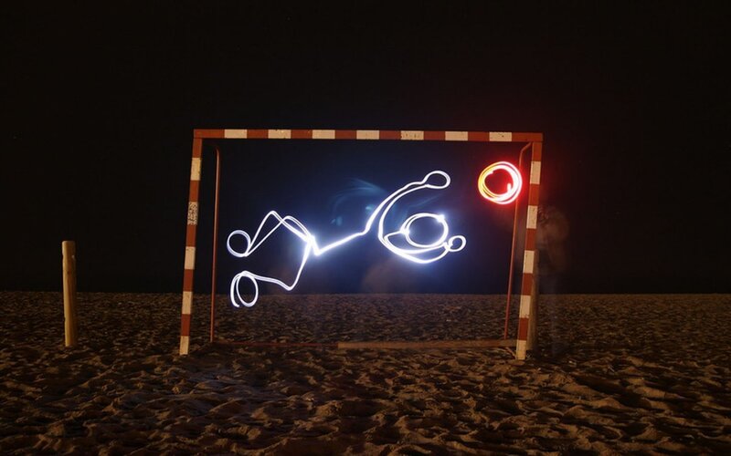 Light painting on a beach at night