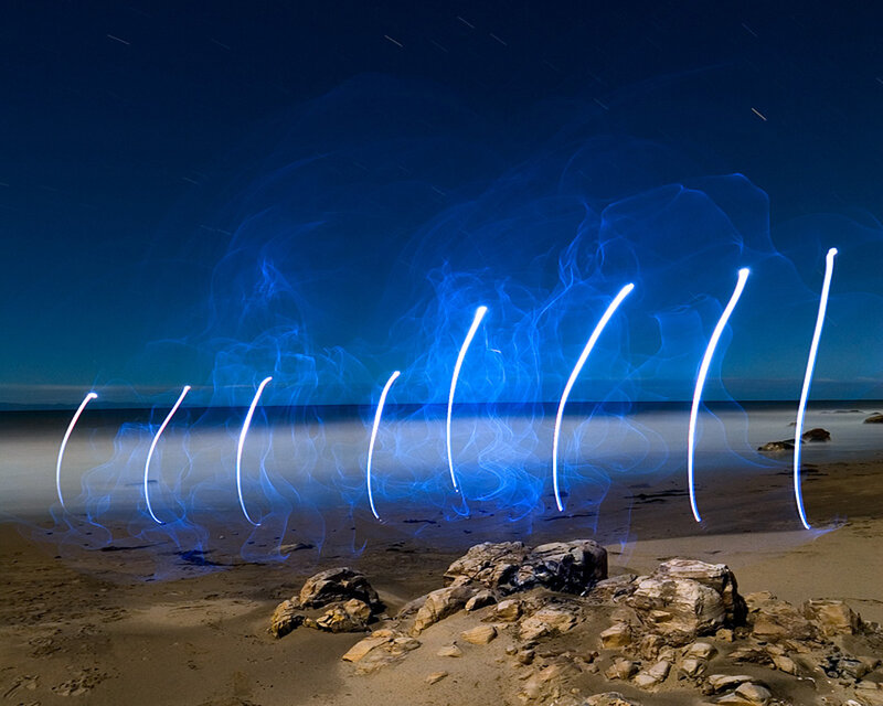 Light painting on a beach at night