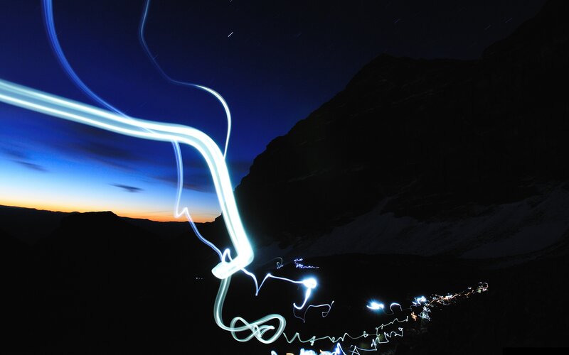 Light painting on a mountain trail
